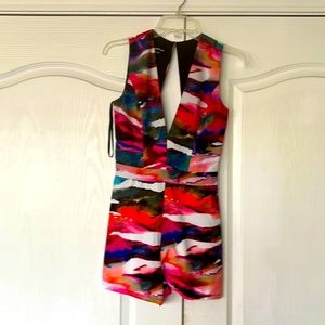 Deep Plunge multi print bebe romper with cut out back detail